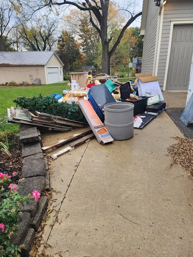 Dumpster being loaded with debris for 3 Yard Dumpster Rental in Stratford